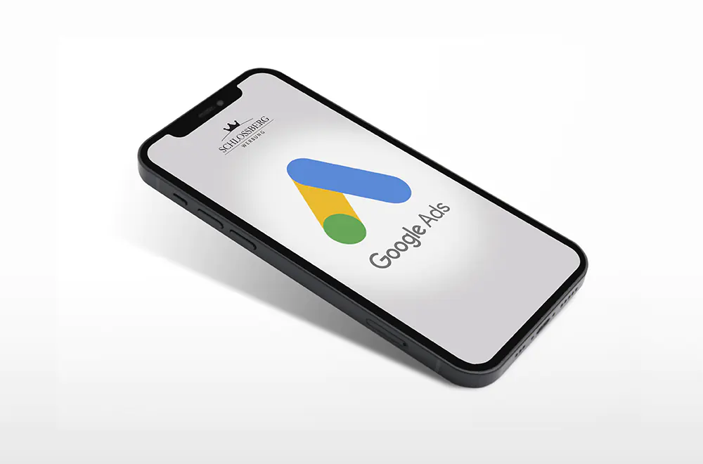 Hier sehen sie ein Bild von einem Handy mit den Symbolbild von Google Ads