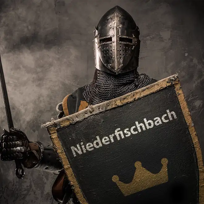 Ritter mit einem Schild in der Hand auf dem Niederfischbach steht.