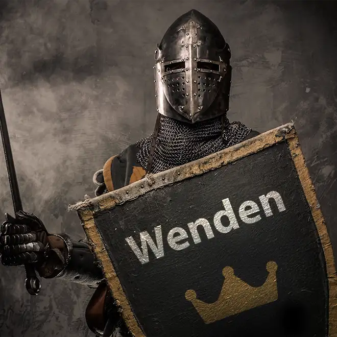 Ritter mit einem Schild in der Hand auf dem Wenden steht und eine Krone abgebildet ist.
